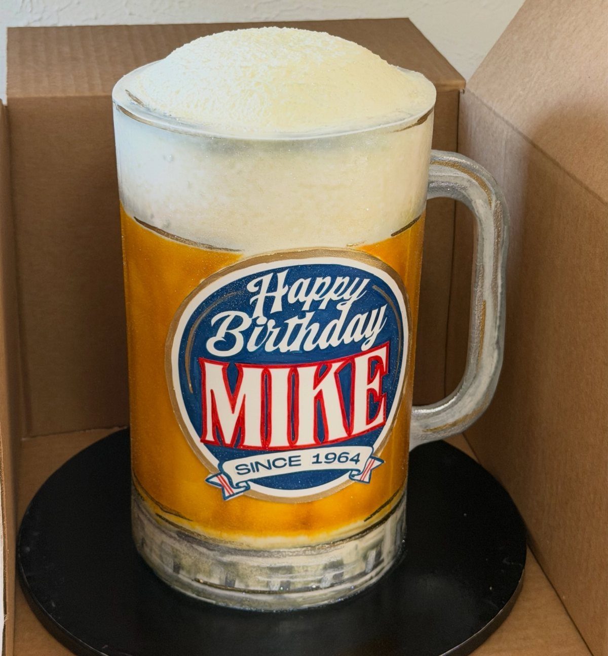 Beer mug with foam and personalized birthday label for Mike in a box