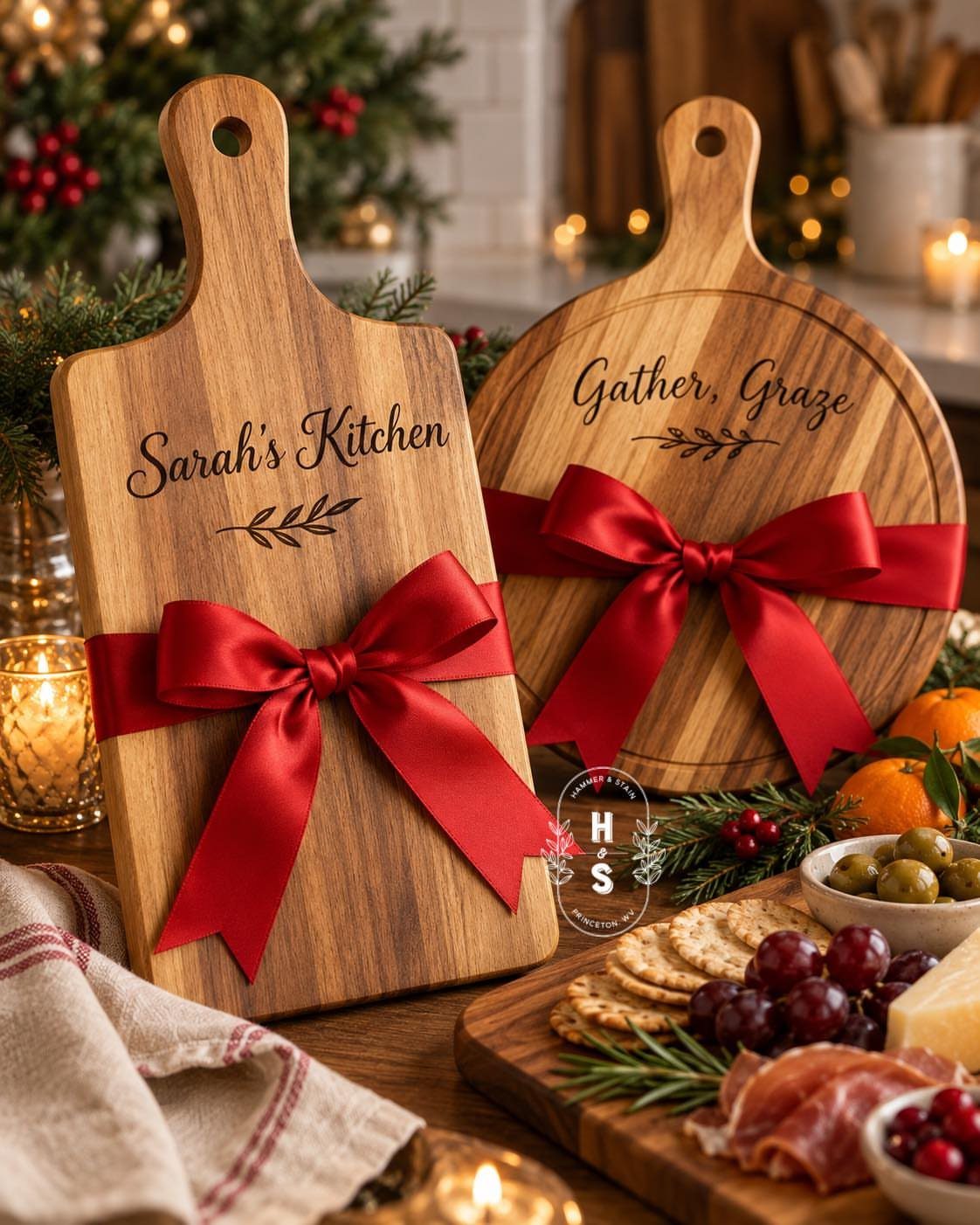 Two personalized wooden cutting boards tied with red ribbons next to a charcuterie board.