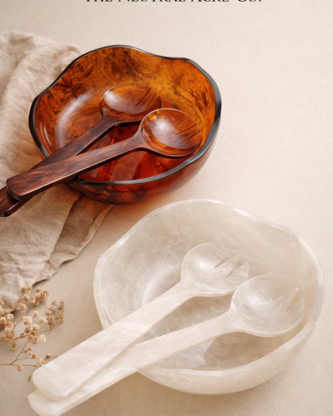 Amber and white translucent serving bowls with matching spoons on a linen cloth.