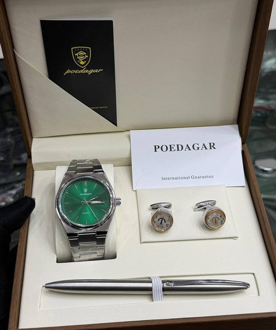 Silver watch with green face, cufflinks, and pen in a luxury gift box.