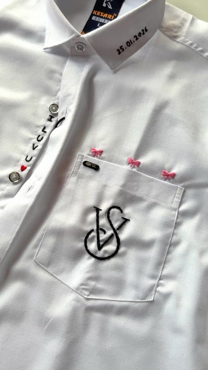 White button-down shirt with embroidered monogram, pink bows, and a date on collar.