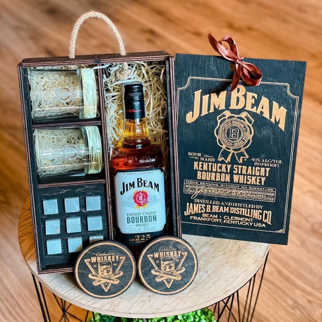 Jim Beam bourbon whiskey gift set with bottle, glasses, and wooden coasters.