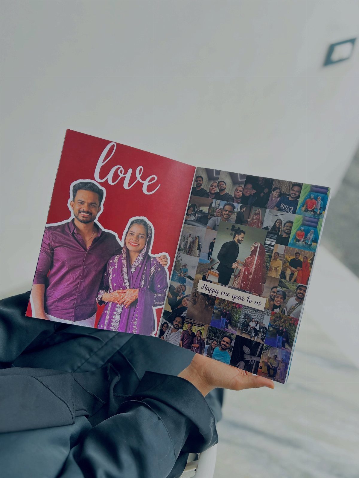Open photo album showing a couple and a collage of memories.