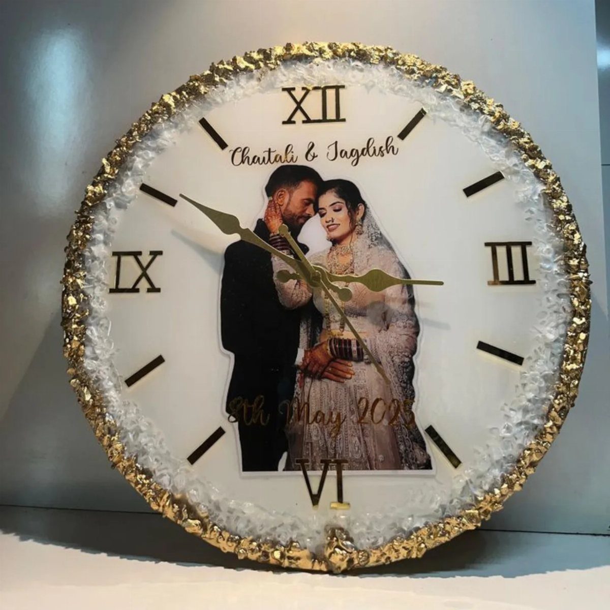 Personalized white wall clock with gold rim and photo of a couple.