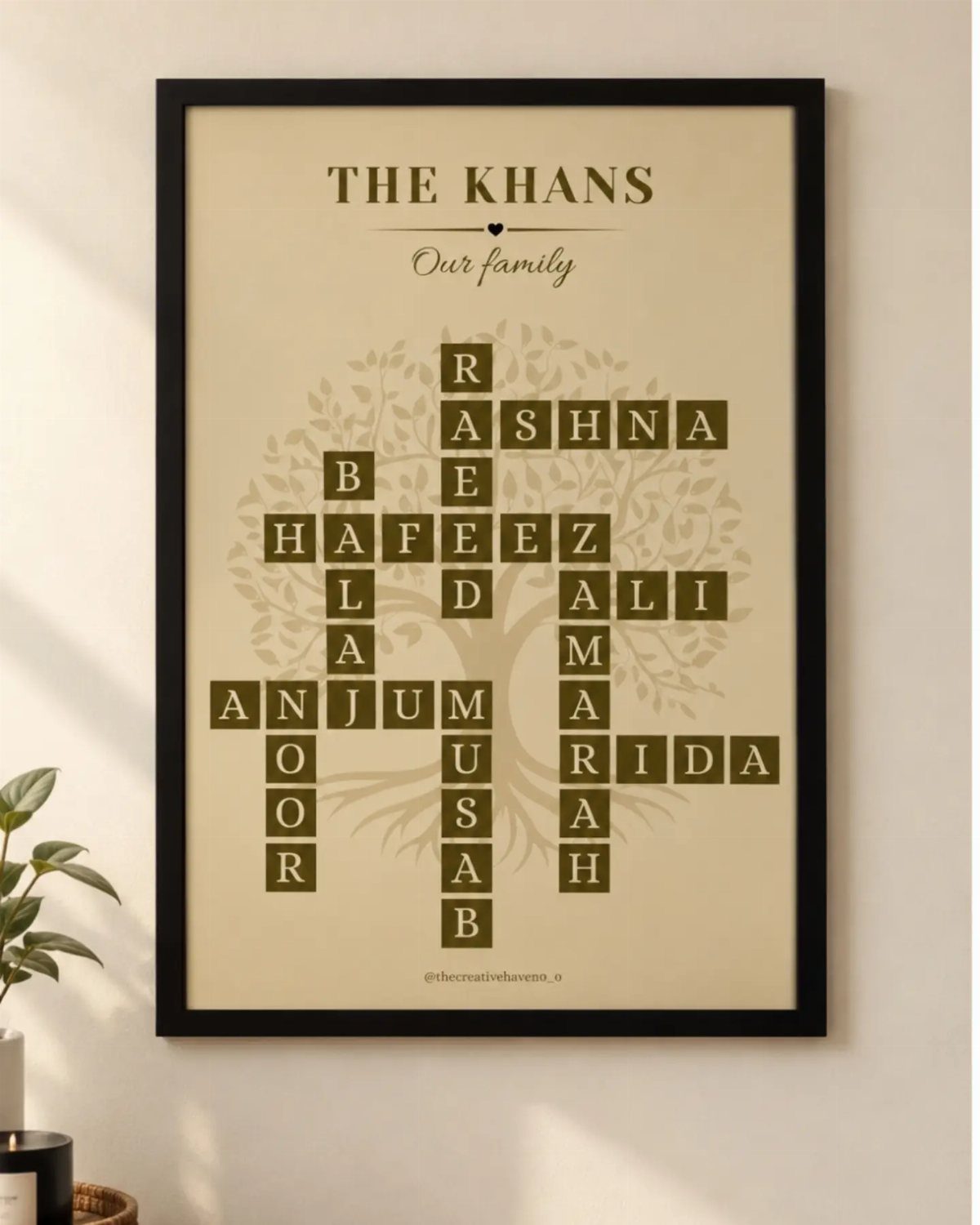 Framed family wall sign featuring a name crossword puzzle over a tree silhouette.