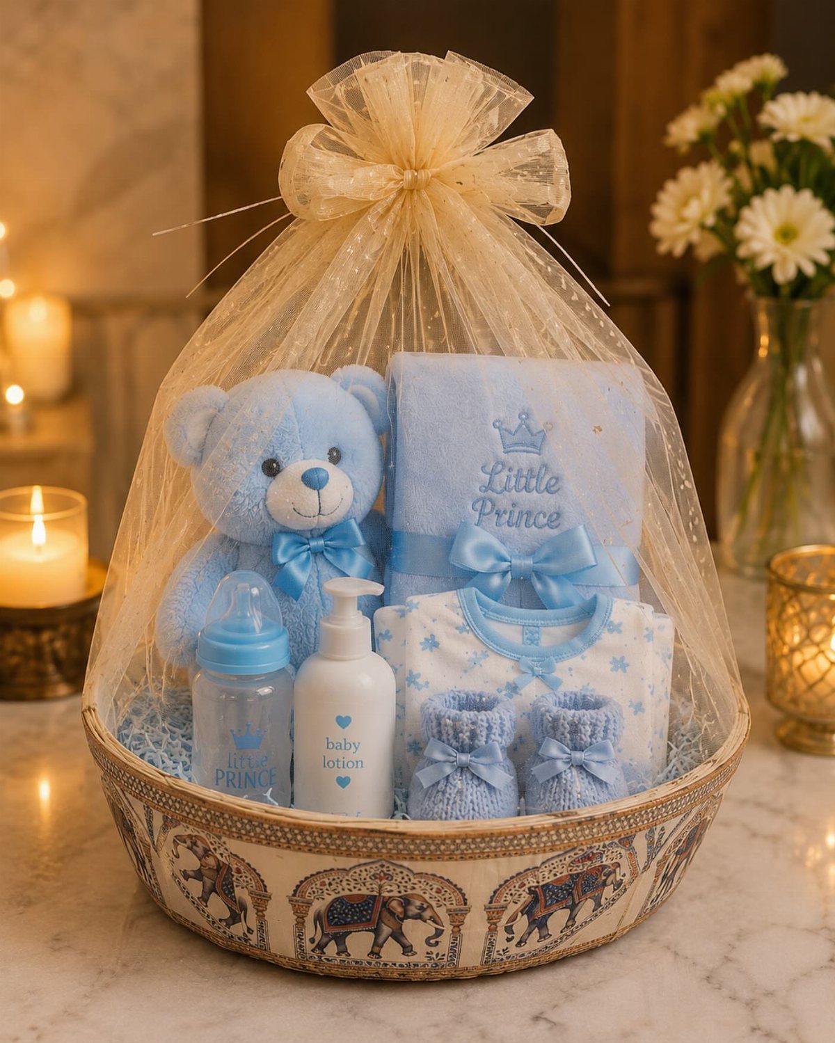 Baby gift hamper with blue teddy bear and clothes in a decorated basket.