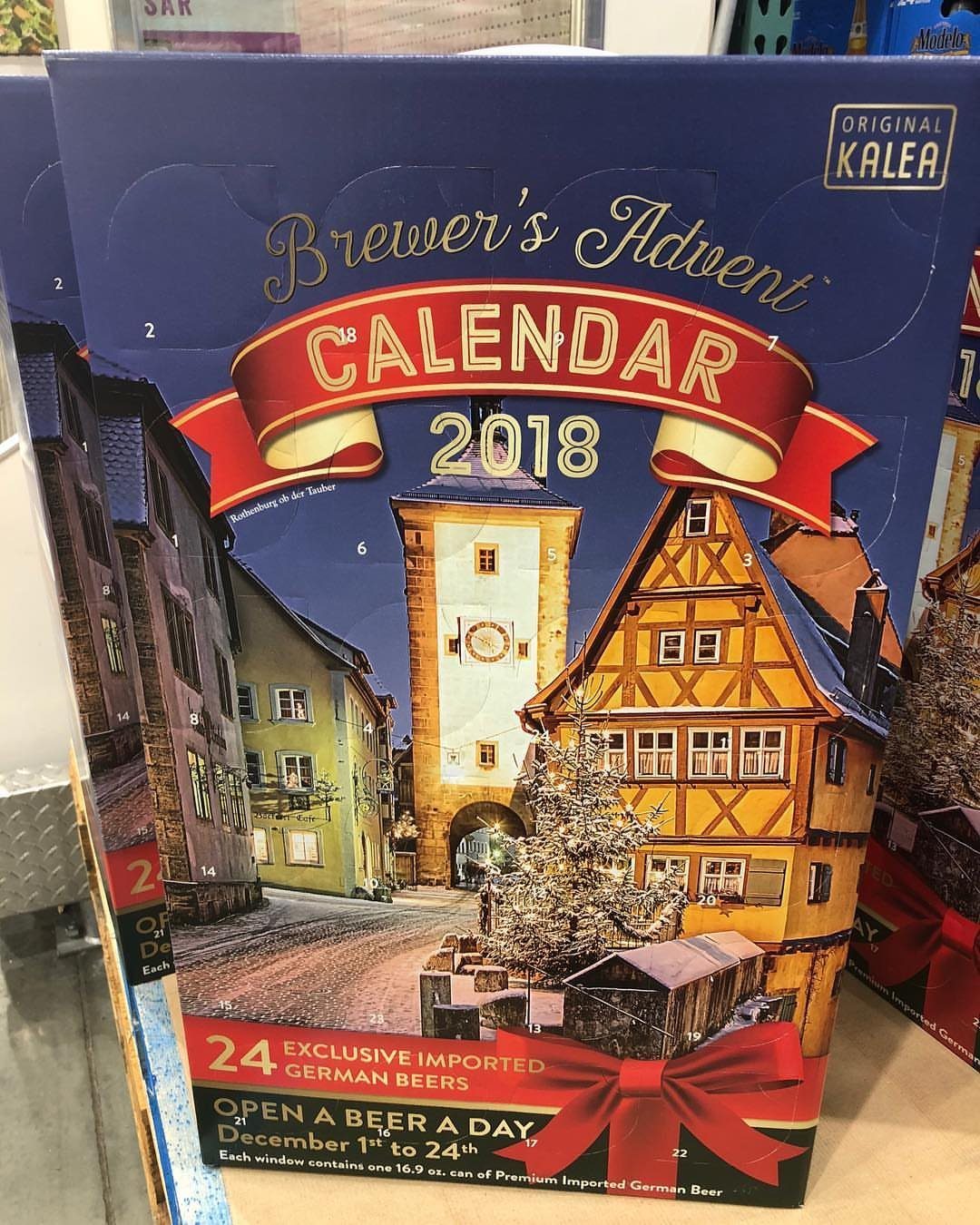 Brewer's Advent Calendar box with a German village illustration and red ribbon accents.