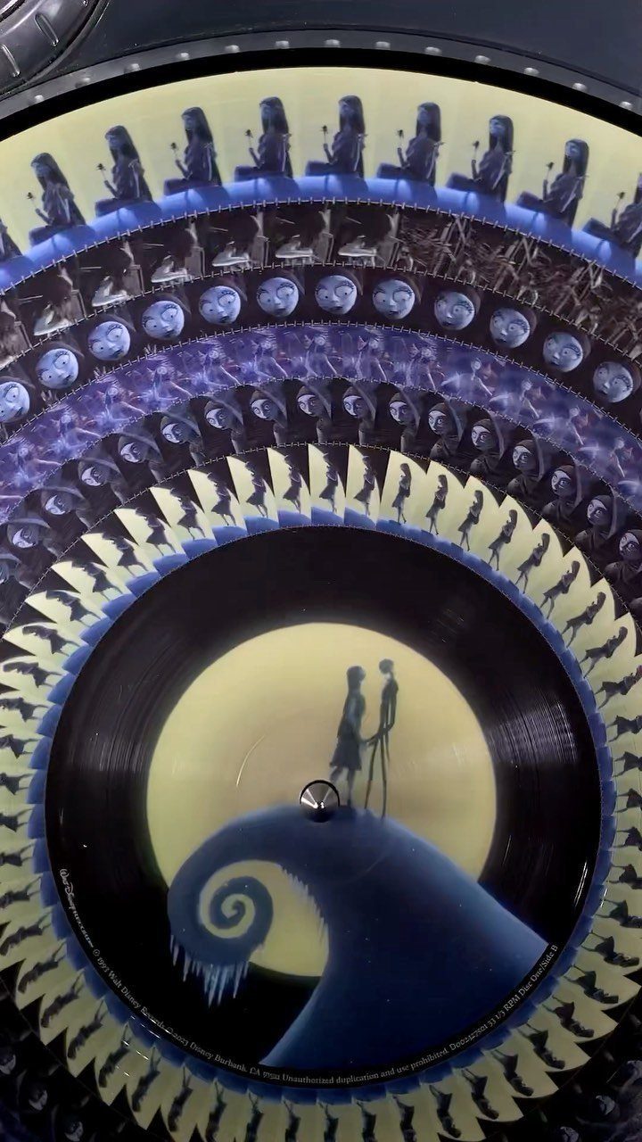 Vinyl record with Nightmare Before Christmas artwork featuring Jack and Sally silhouettes.