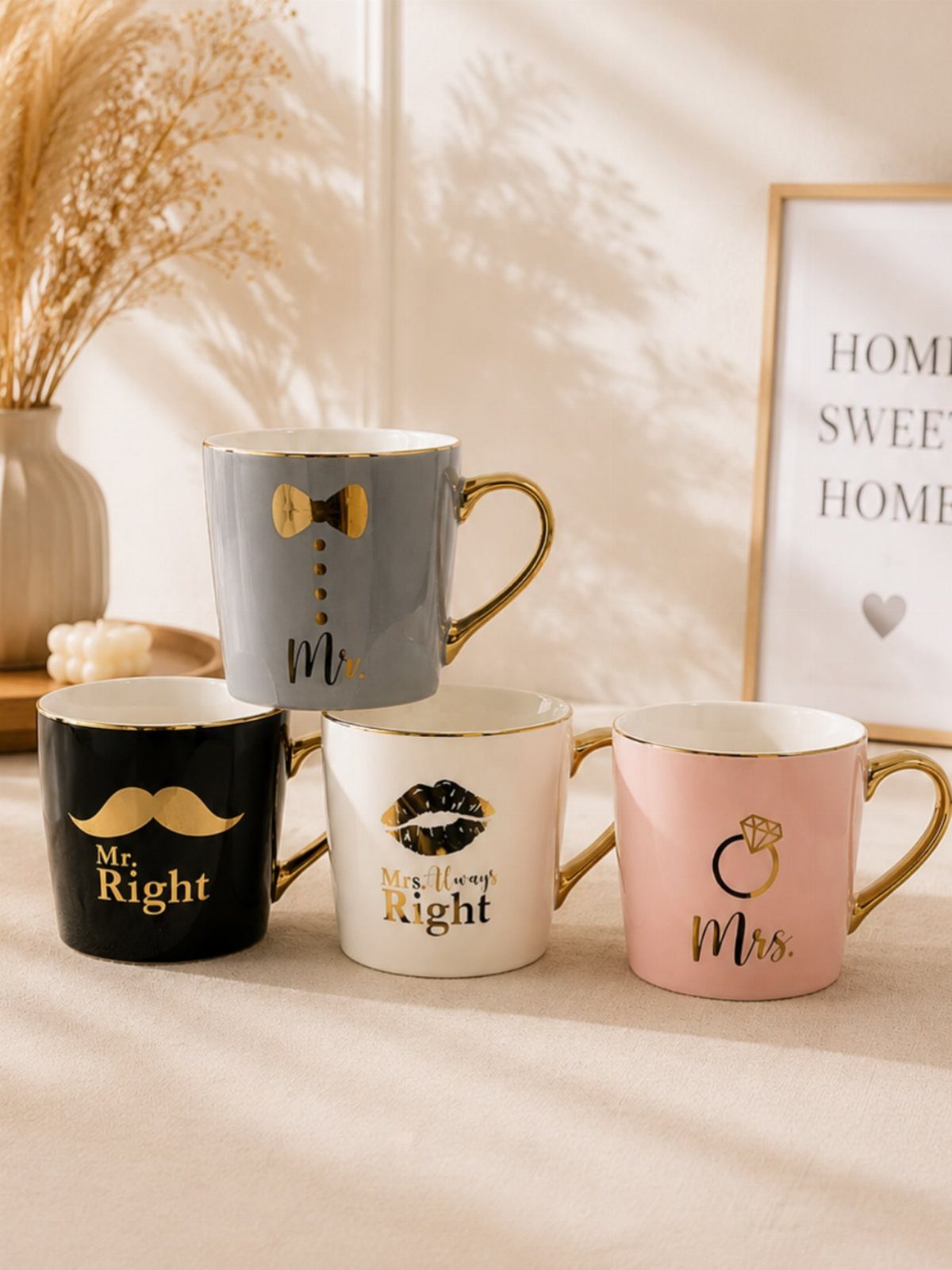 Four themed coffee mugs for couples with gold accents and romantic text