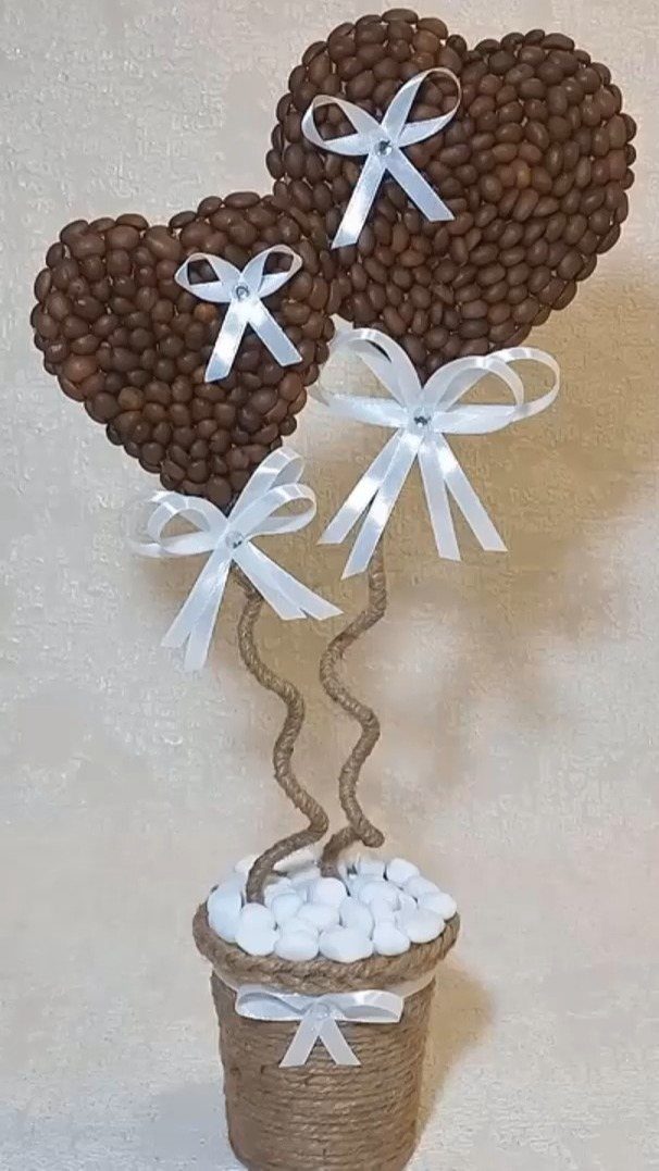 19 Coffee Fan Gifts for Every Budget and Brew Style 12 Two coffee bean hearts on twine stems in a small twine-wrapped pot.