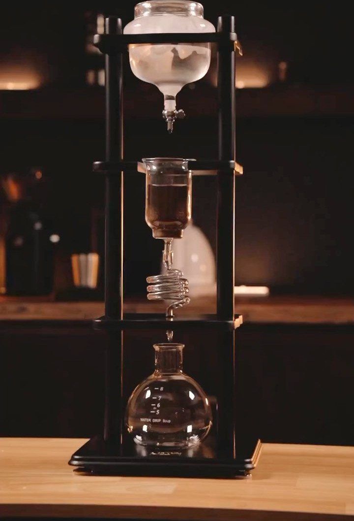 19 Coffee Fan Gifts for Every Budget and Brew Style 15 Cold drip coffee maker with glass vessels in a black wooden frame