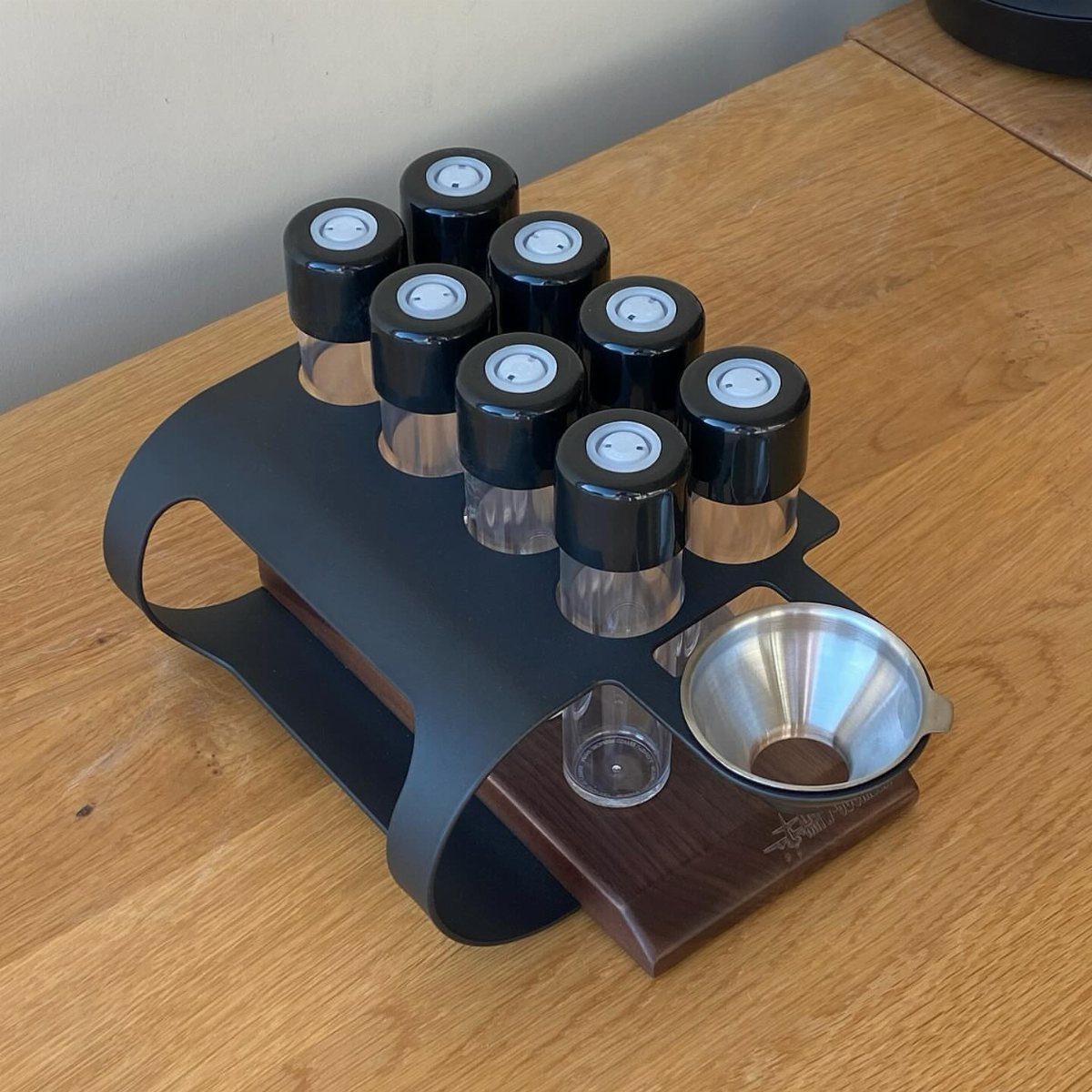 19 Coffee Fan Gifts for Every Budget and Brew Style 9 Coffee bean organizer with glass canisters and a metal scoop on a wooden table