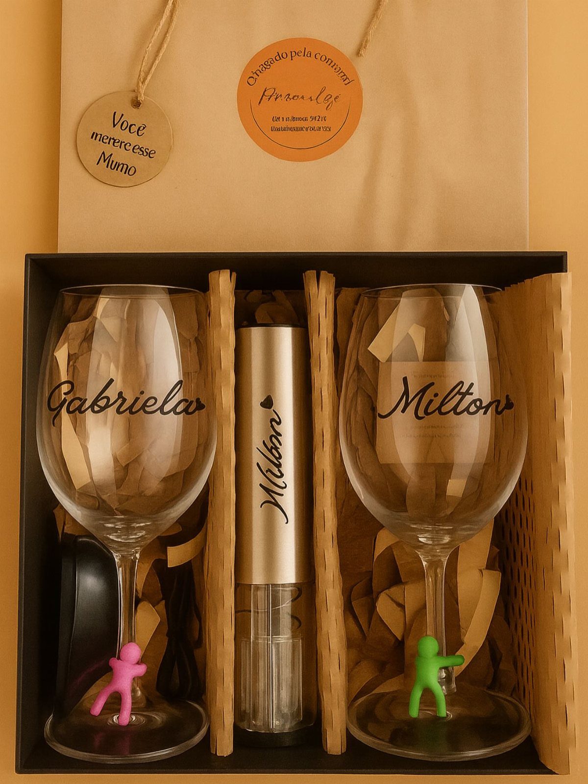 Two personalized wine glasses with names in a black gift box with accessories.
