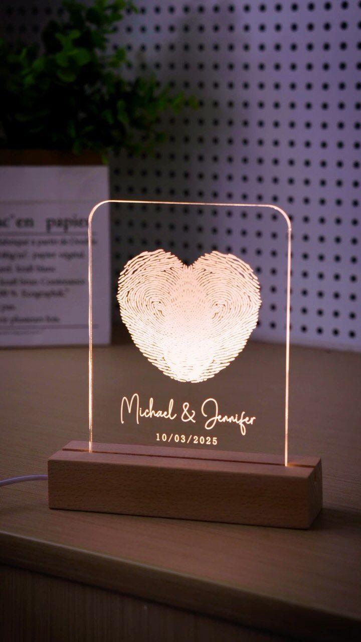 Custom Engraved Gifts: 10 Ideas for Every Occasion 5 Acrylic light sign with heart fingerprint and names in a wooden base.