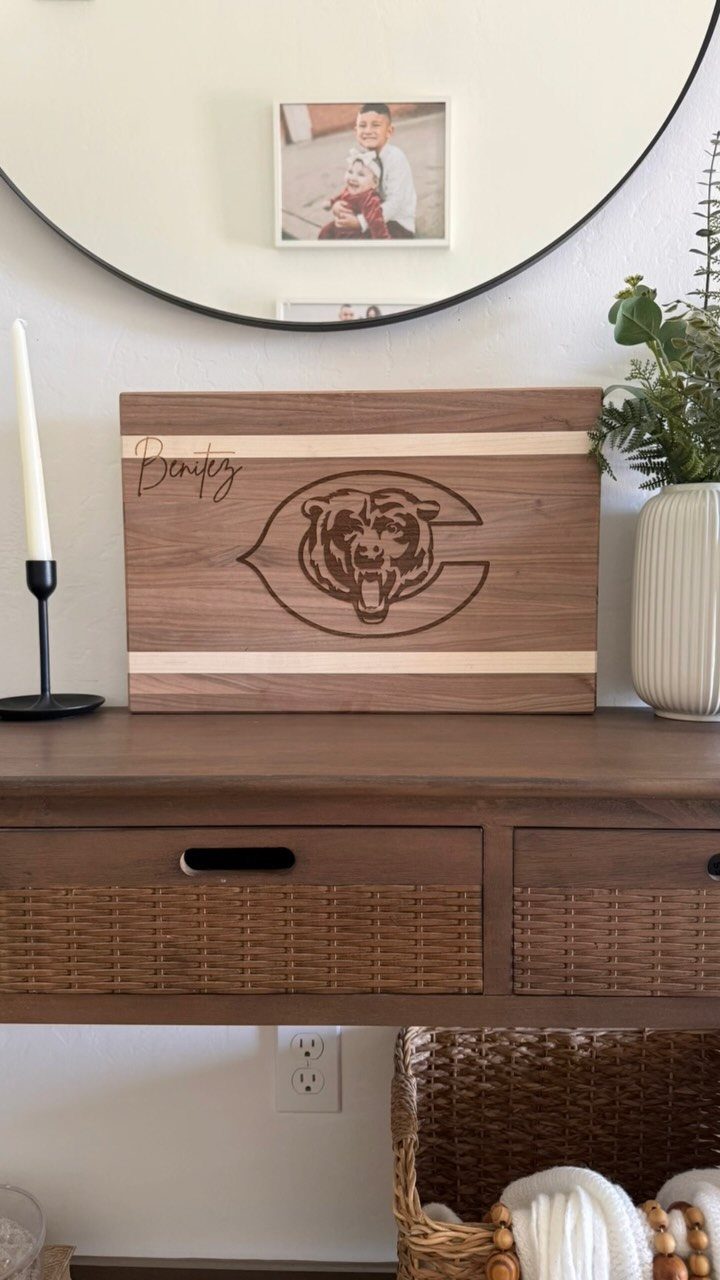 Custom Engraved Gifts: 10 Ideas for Every Occasion 2 Engraved wooden cutting board with a bear logo and name on a table.