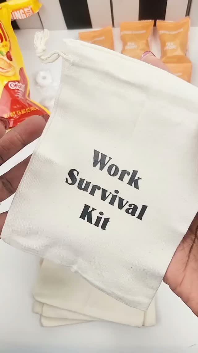 White fabric drawstring bag labeled Work Survival Kit held in two hands