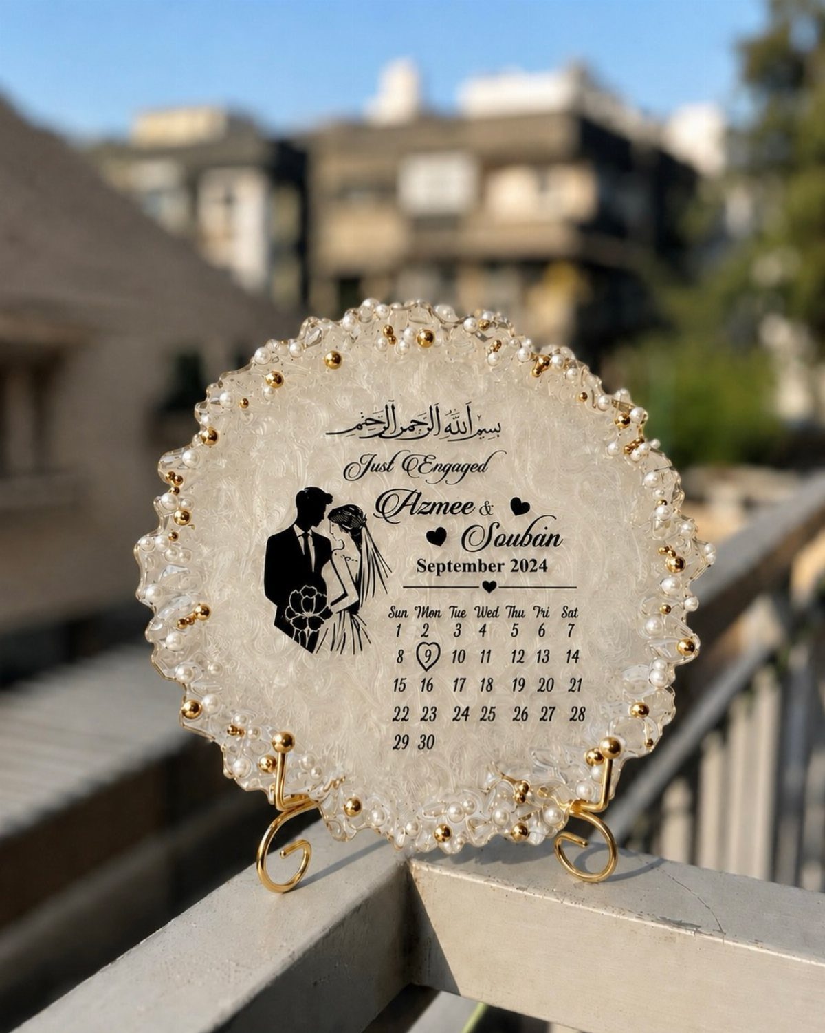 Circular resin engagement plaque with a couple's silhouette and a September 2024 calendar.