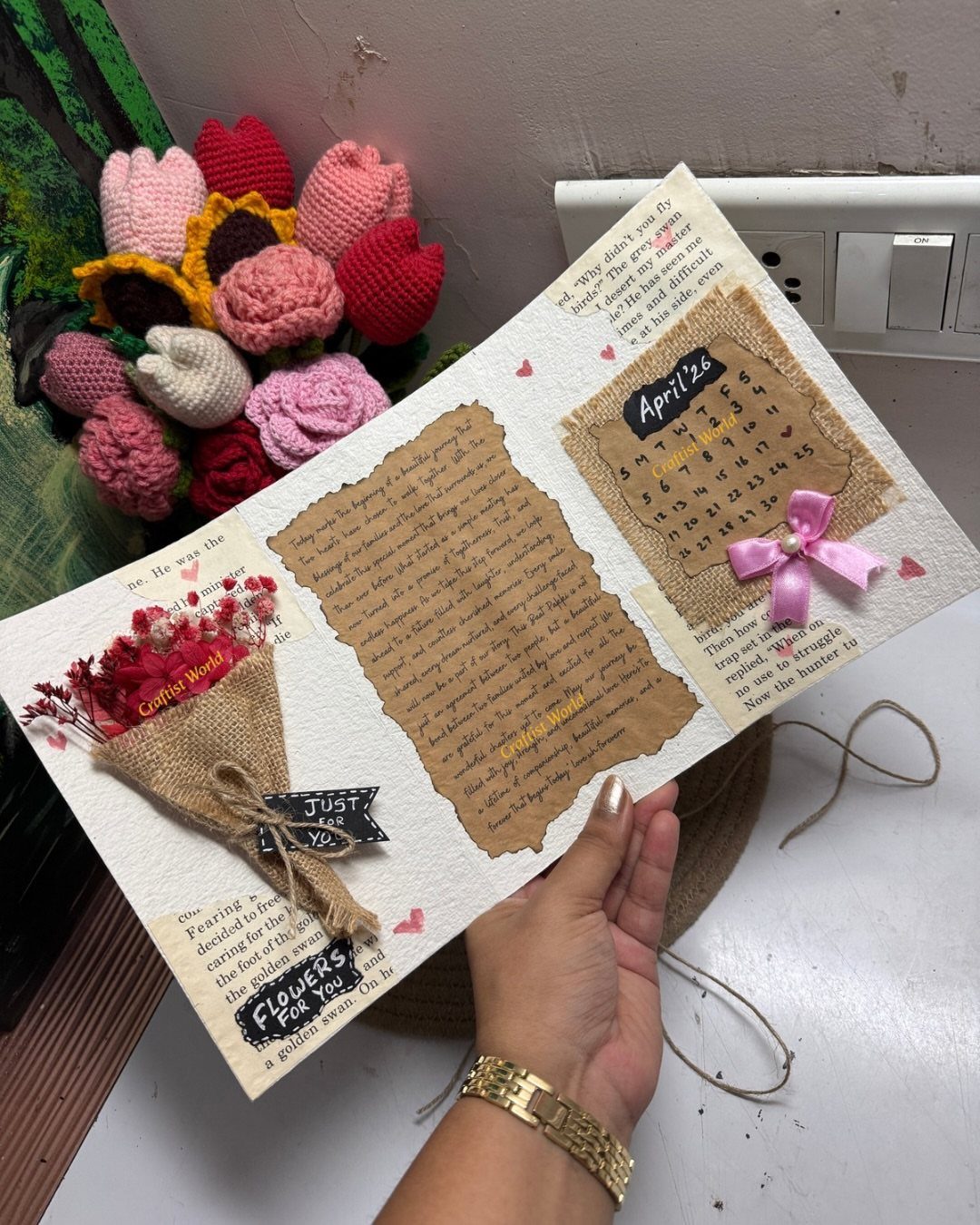 Handmade scrapbook page with handwritten notes, a mini flower bouquet, and a calendar.