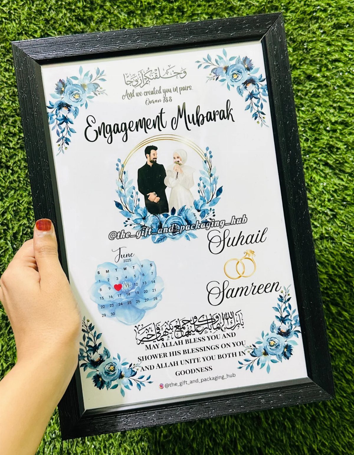 Personalized engagement frame with blue flowers, couple illustration, and names on white background.