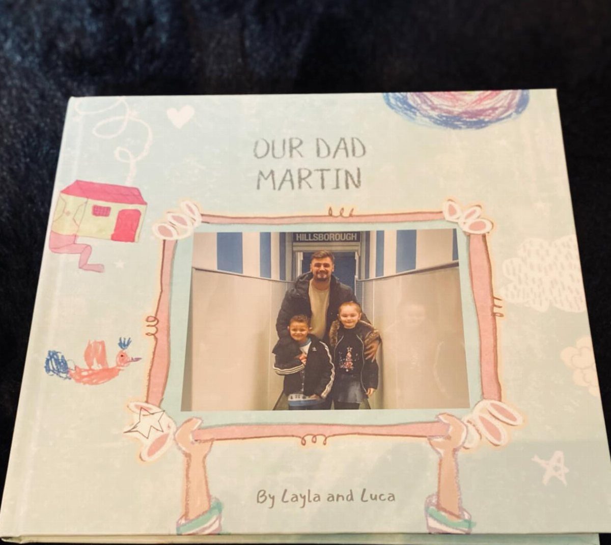 Personalized children's book cover featuring a photo of a father and two children.