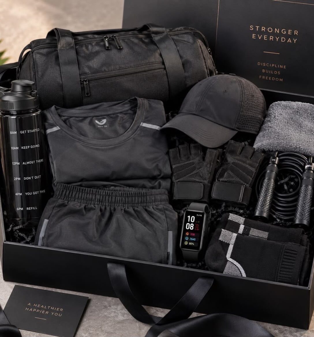22 Gift Ideas for Brother, From Hoodies to Gadgets 11 Fitness gift set in a black box with gym gear and accessories