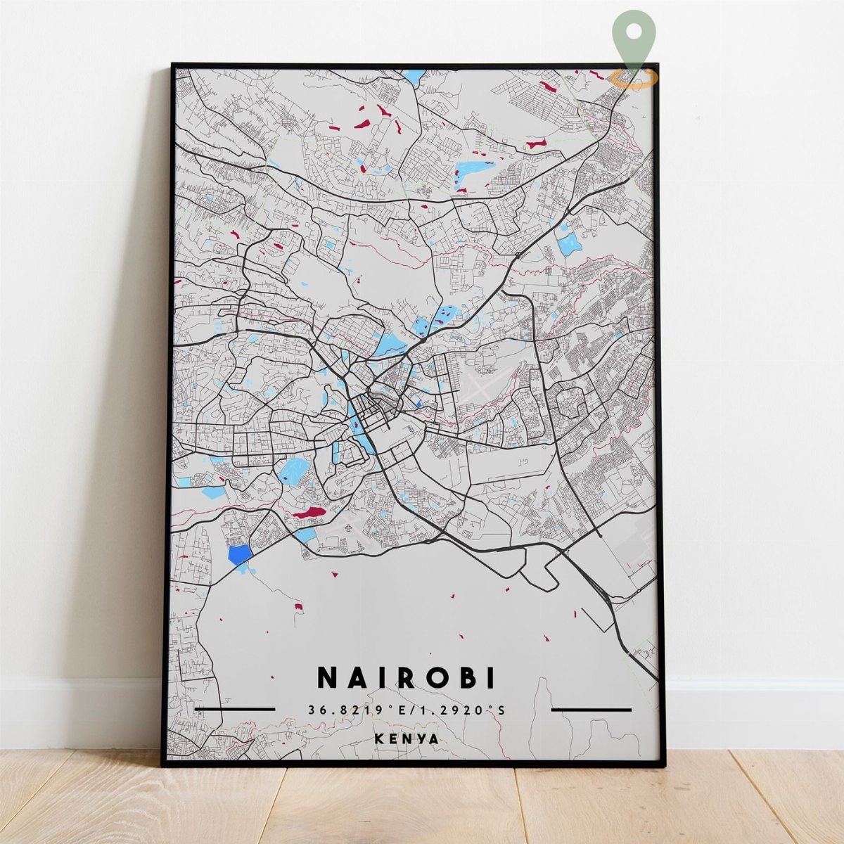 22 Gift Ideas for Brother, From Hoodies to Gadgets 14 Framed map of Nairobi, Kenya, leaning against a white wall on wooden flooring.