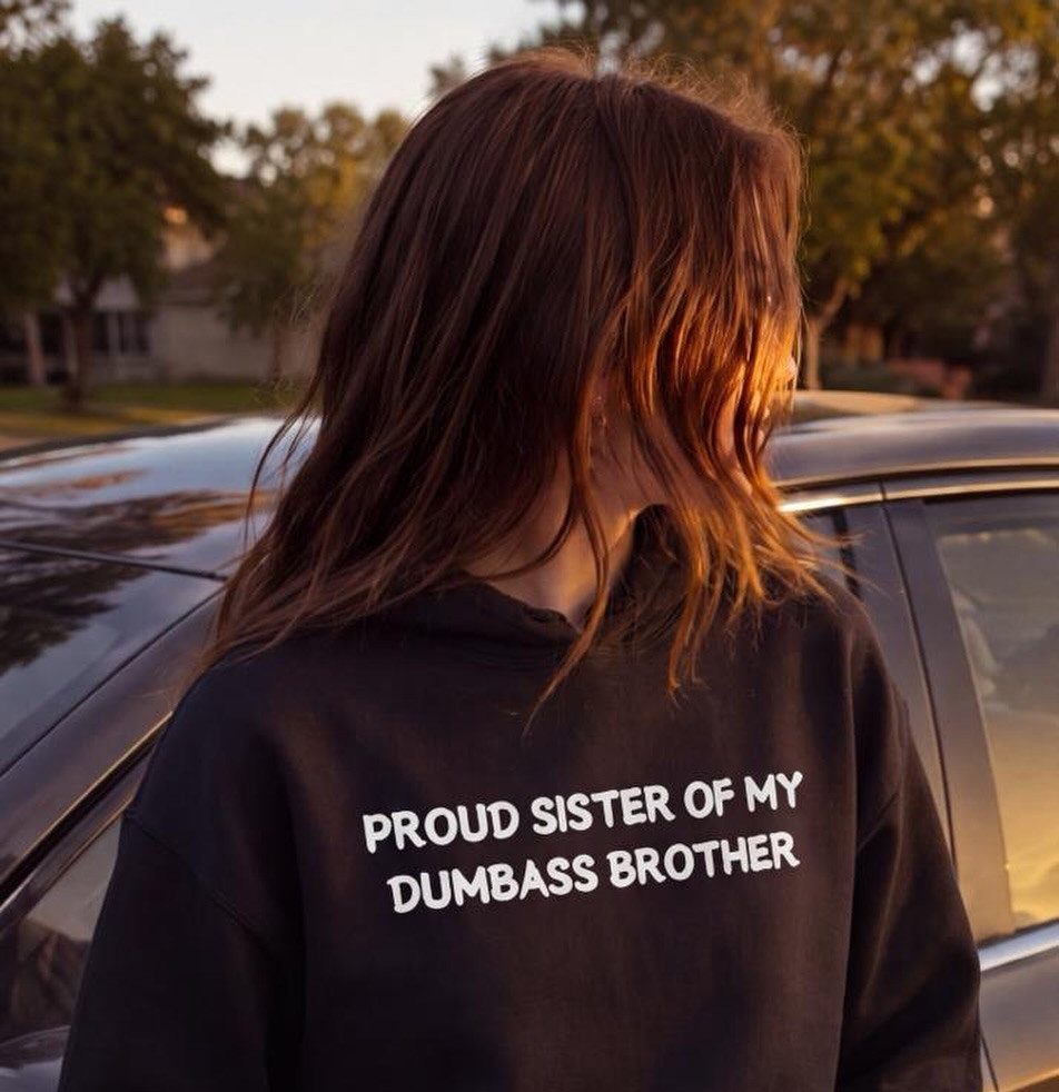 22 Gift Ideas for Brother, From Hoodies to Gadgets 8 Person wearing a black hoodie with a funny quote about their brother.