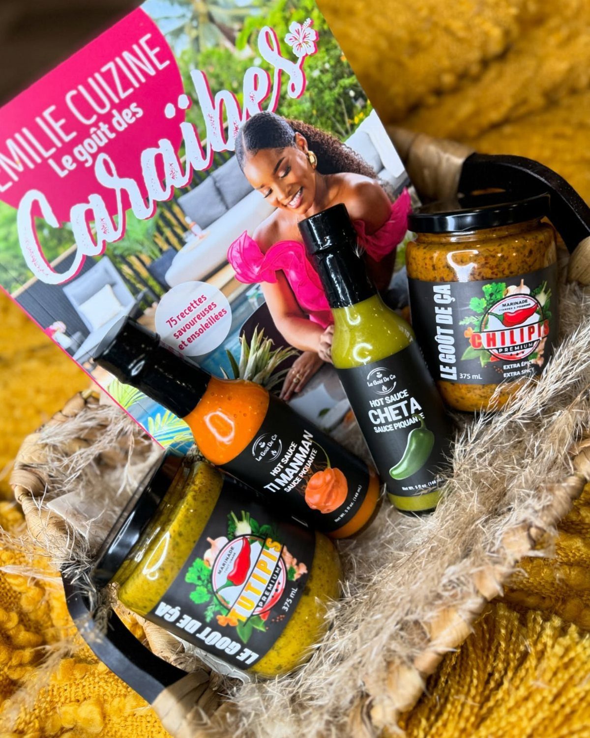 22 Gift Ideas for Brother, From Hoodies to Gadgets 13 Hot sauce bottles and condiment jars with a Caribbean cookbook in a basket