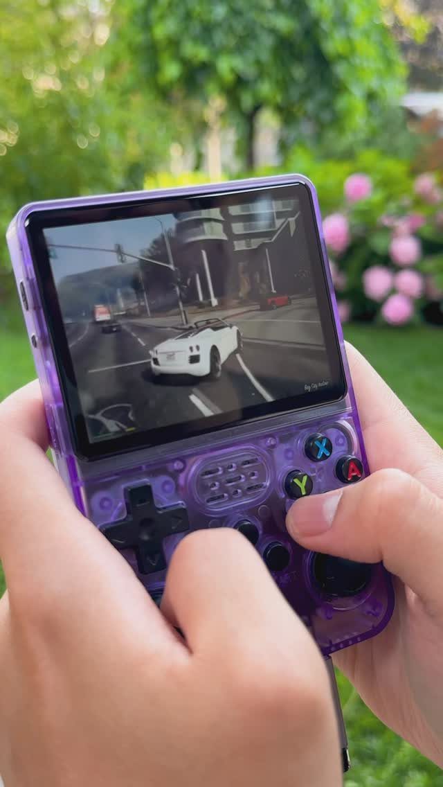 22 Gift Ideas for Brother, From Hoodies to Gadgets 12 Translucent purple handheld gaming console showing a car racing game in a garden