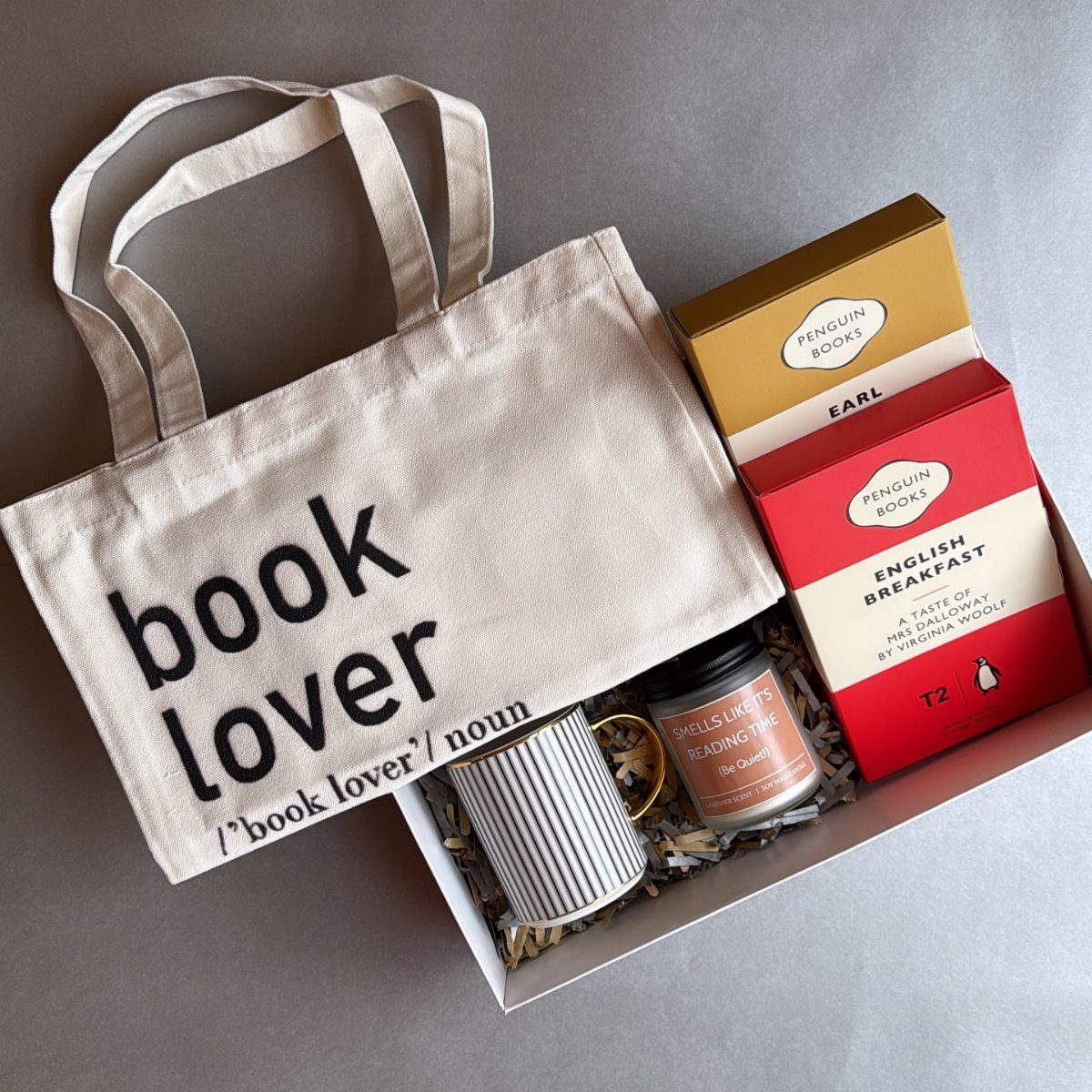 Canvas tote bag with book lover text in a gift box with tea.