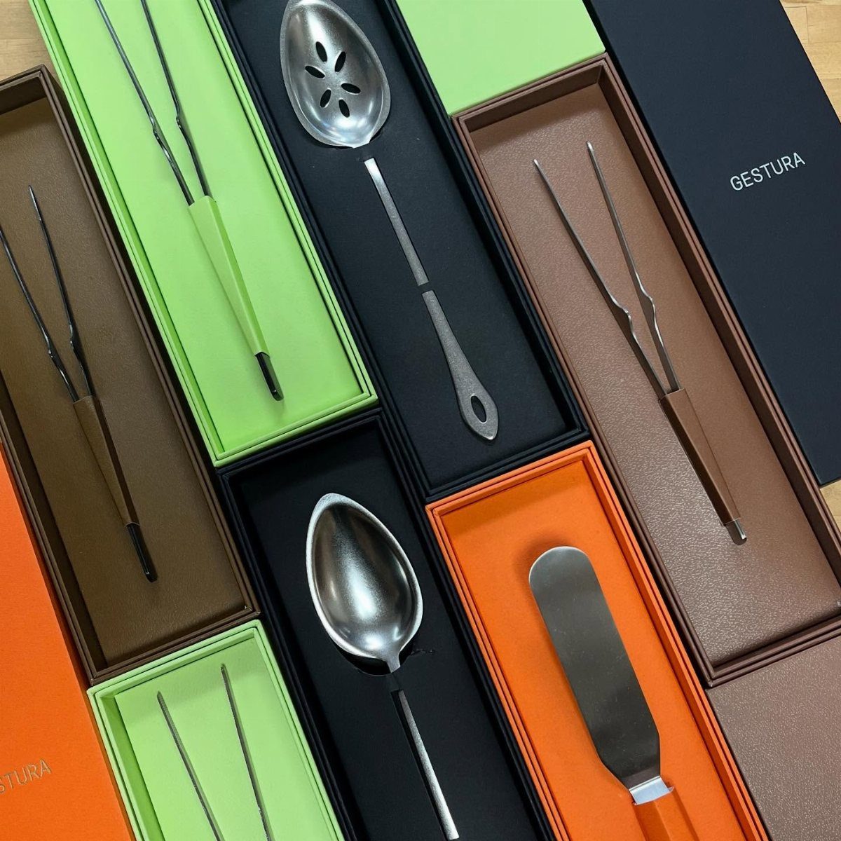Professional culinary plating tools in colorful presentation boxes for a chef gift.