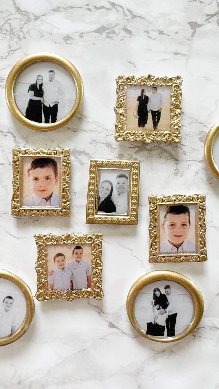 8 Gifts for People Who Have Everything 8 Gold picture frames with family photos arranged on a white marble background