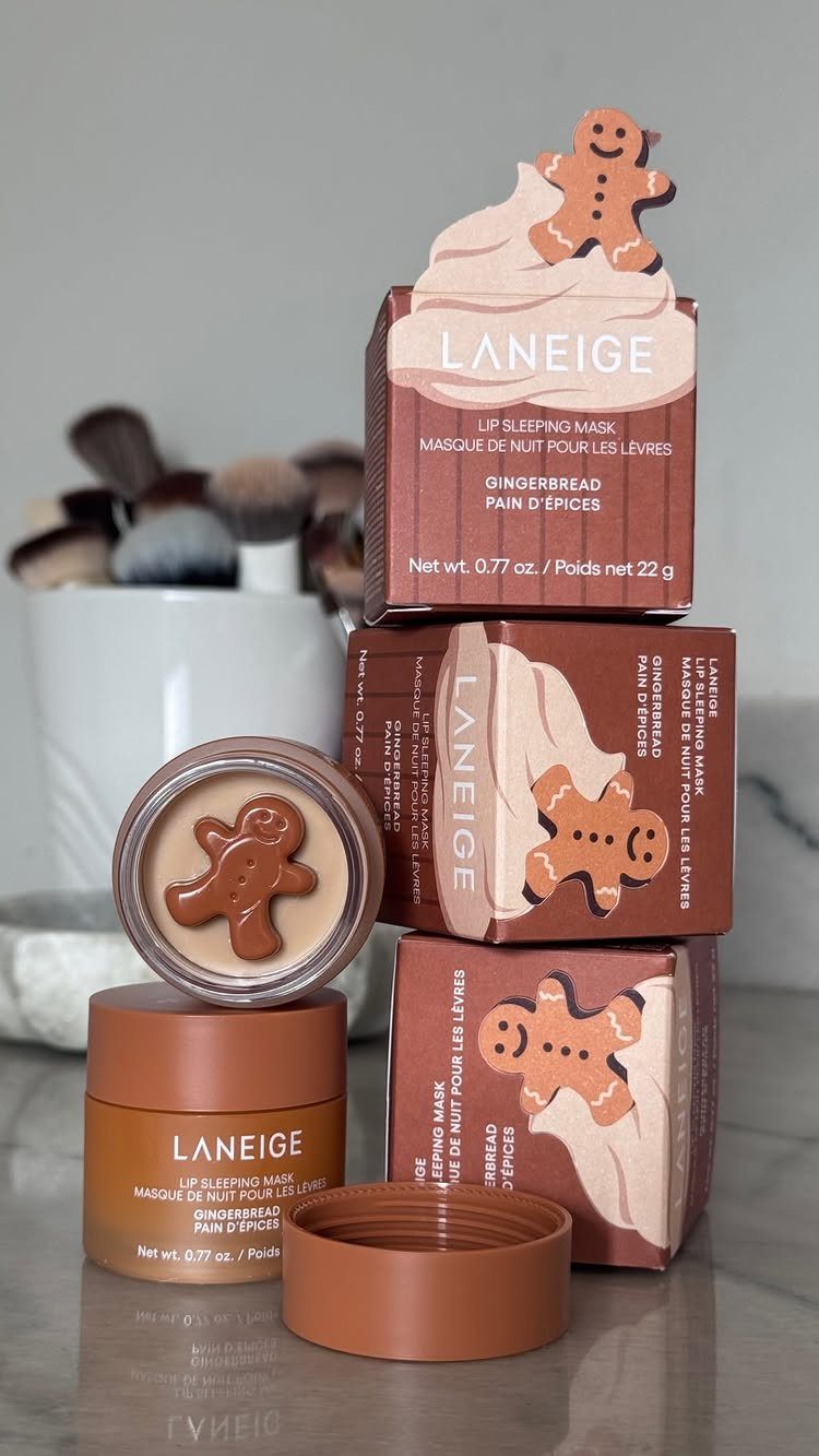 Laneige Lip Sleeping Mask gingerbread edition jars and boxes on a reflective surface