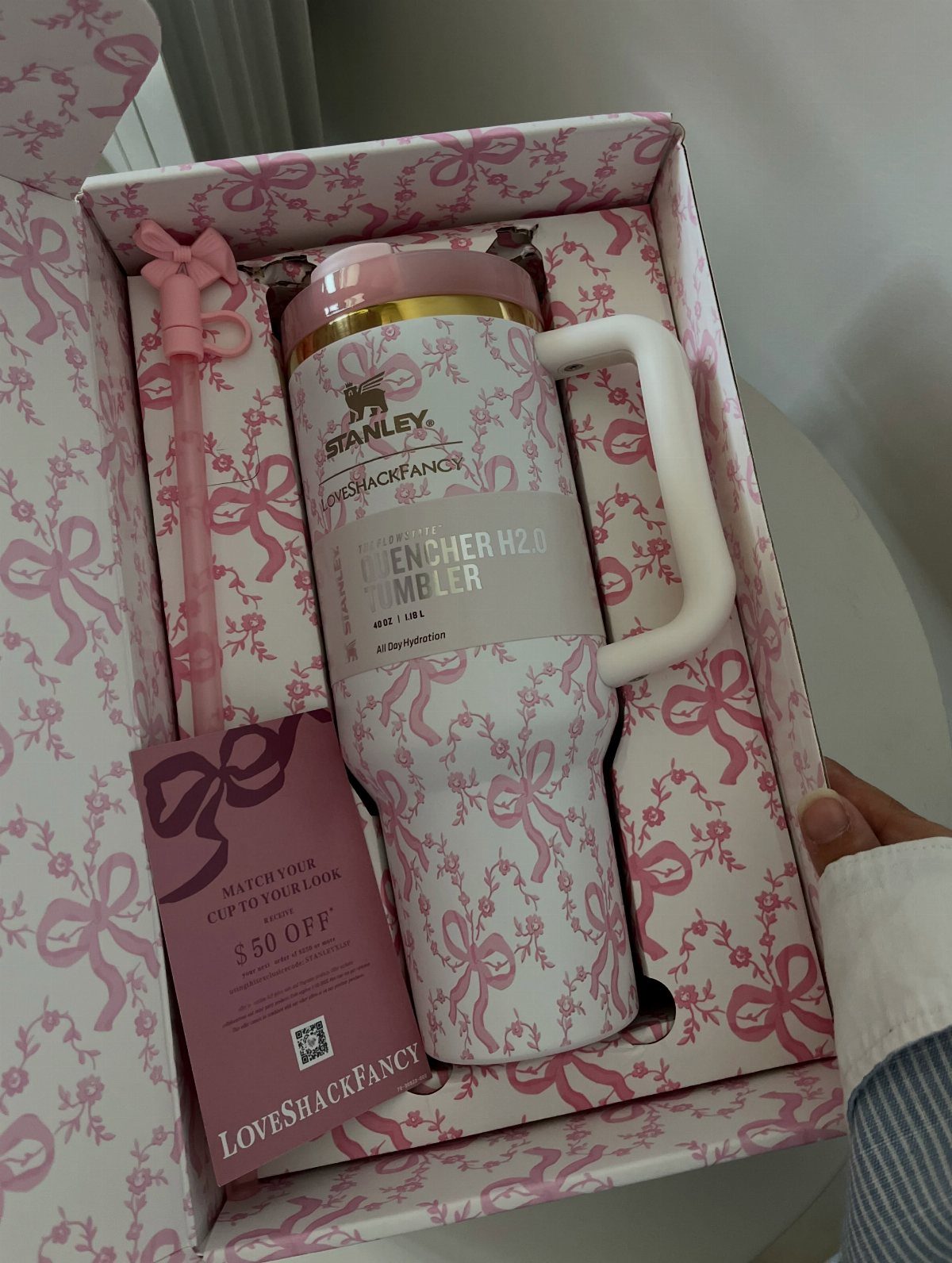White Stanley Quencher tumbler with pink bows in a matching gift box