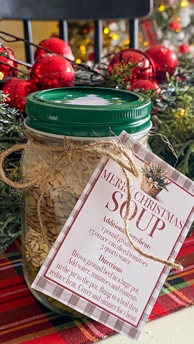 Mason jar filled with dried soup mix and a Christmas recipe tag.