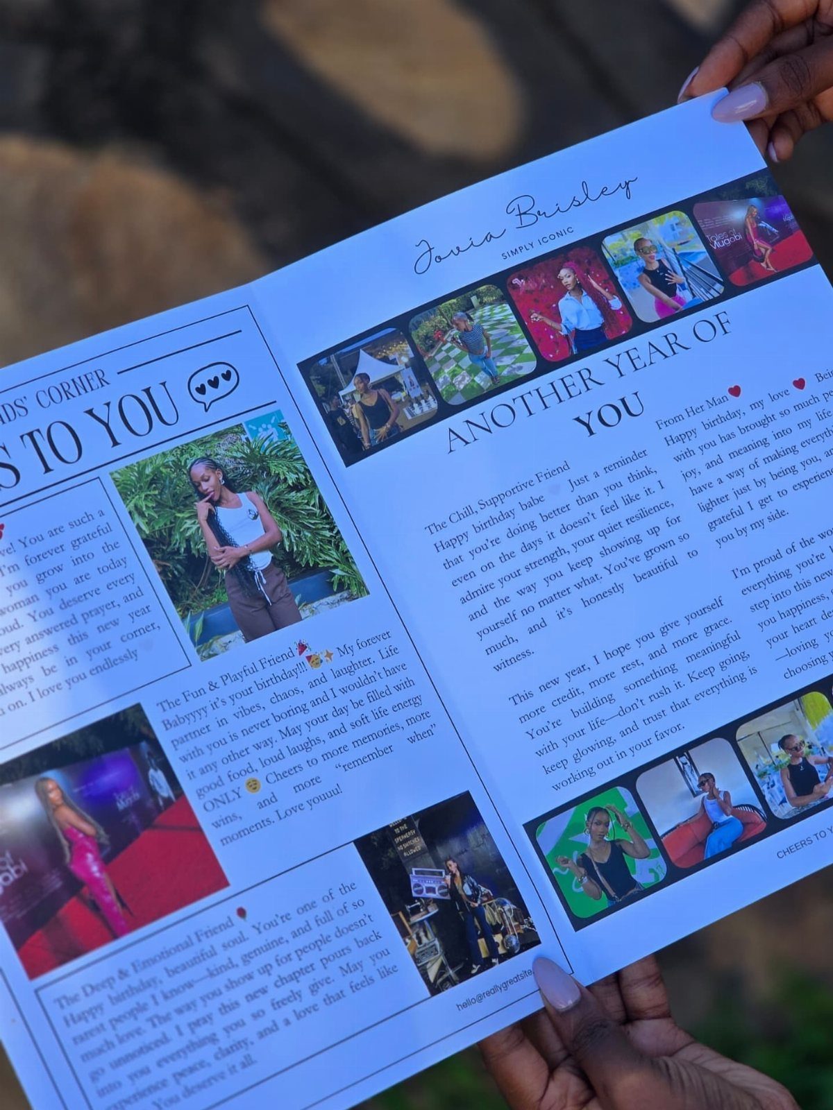 Personalized photo book with pictures and messages held by a person's hands.