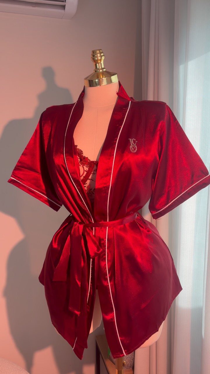 Red satin robe and lace lingerie displayed on a mannequin for Valentine's Day.