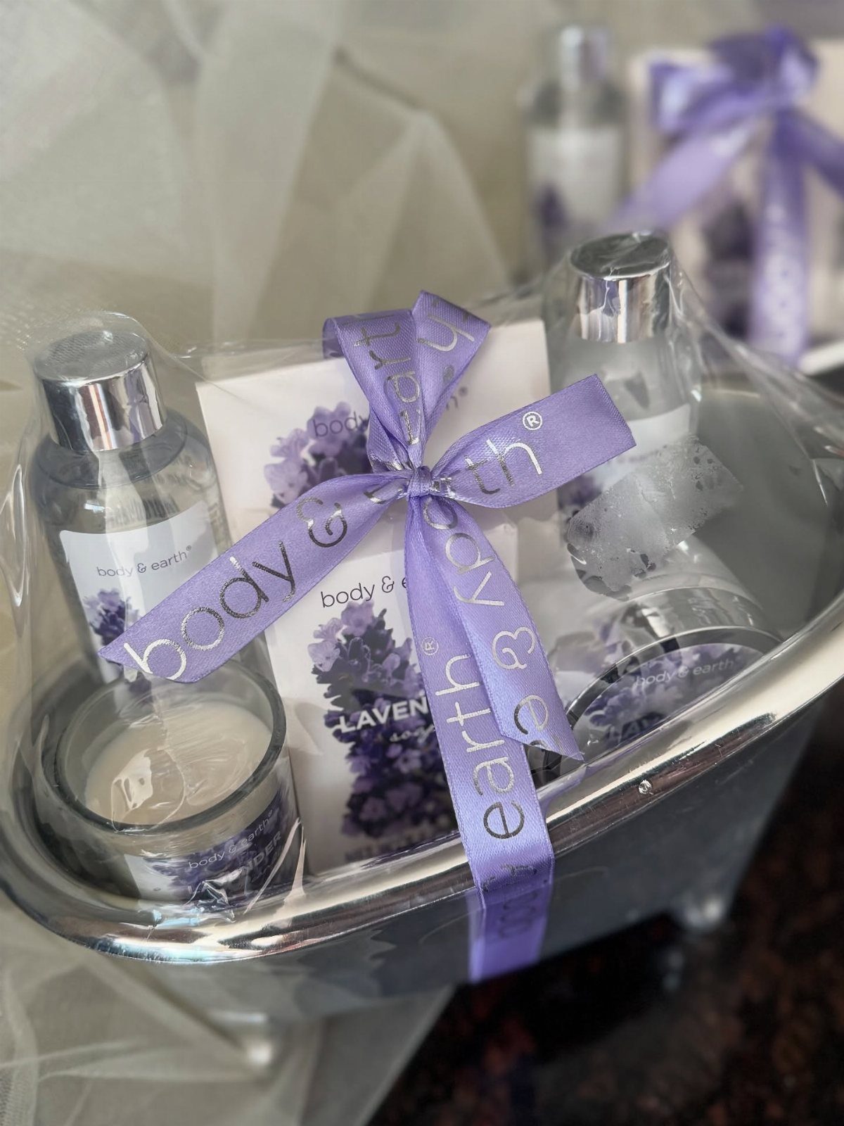 Lavender spa gift set in a silver tub tied with a purple ribbon