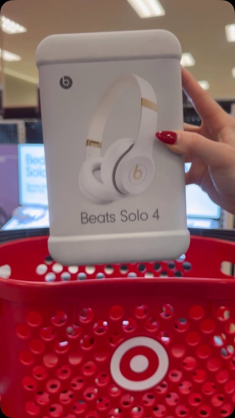 Beats Solo 4 headphones box held over a red Target shopping basket