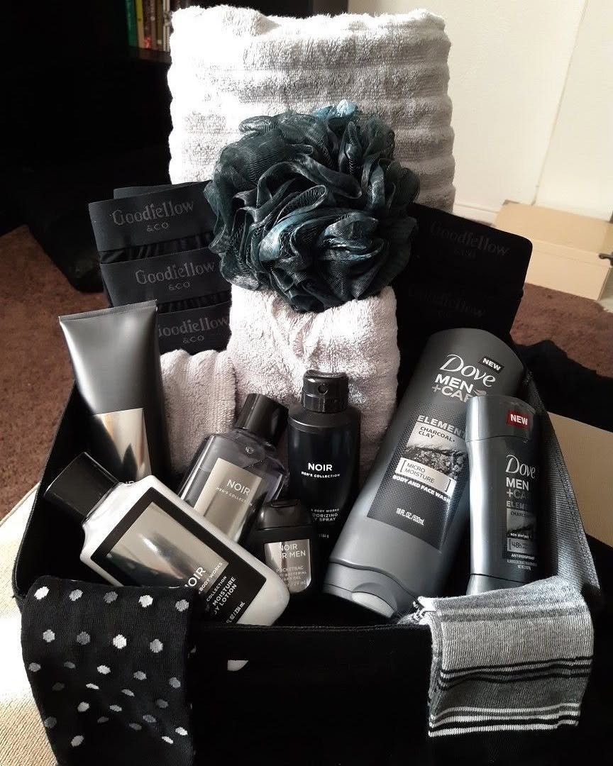 Grooming gift box with Dove products, towels, socks, and a bath sponge.