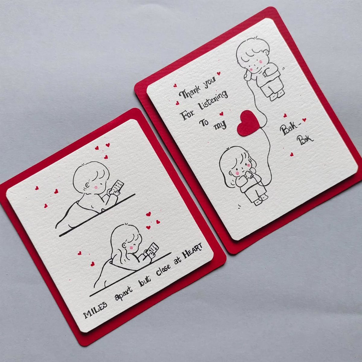 Handmade Valentine's Day cards with cute line drawings and red heart accents.