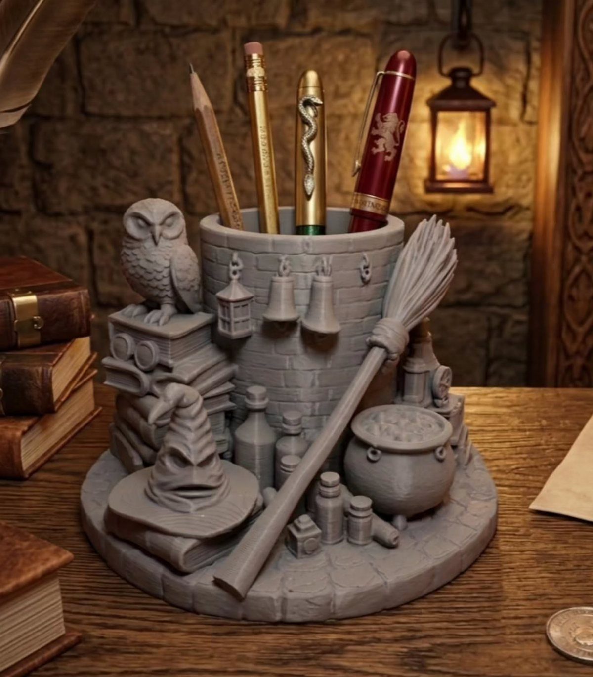 25 Best Harry Potter Gifts for Every Wizarding Fan in 2026 10 Grey 3D-printed Harry Potter castle desk organizer holding pens on a wooden table.