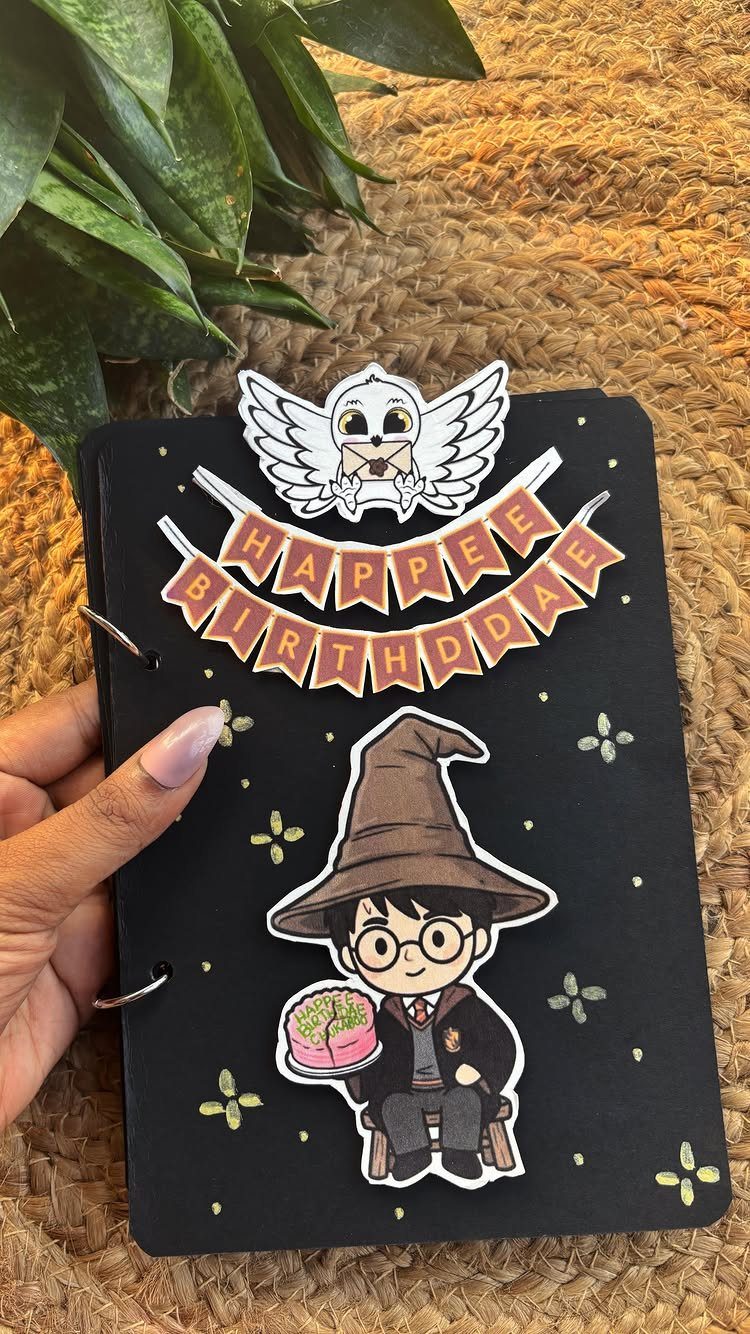 25 Best Harry Potter Gifts for Every Wizarding Fan in 2026 7 Black ring-bound notebook decorated with Harry Potter stickers and a birthday banner.