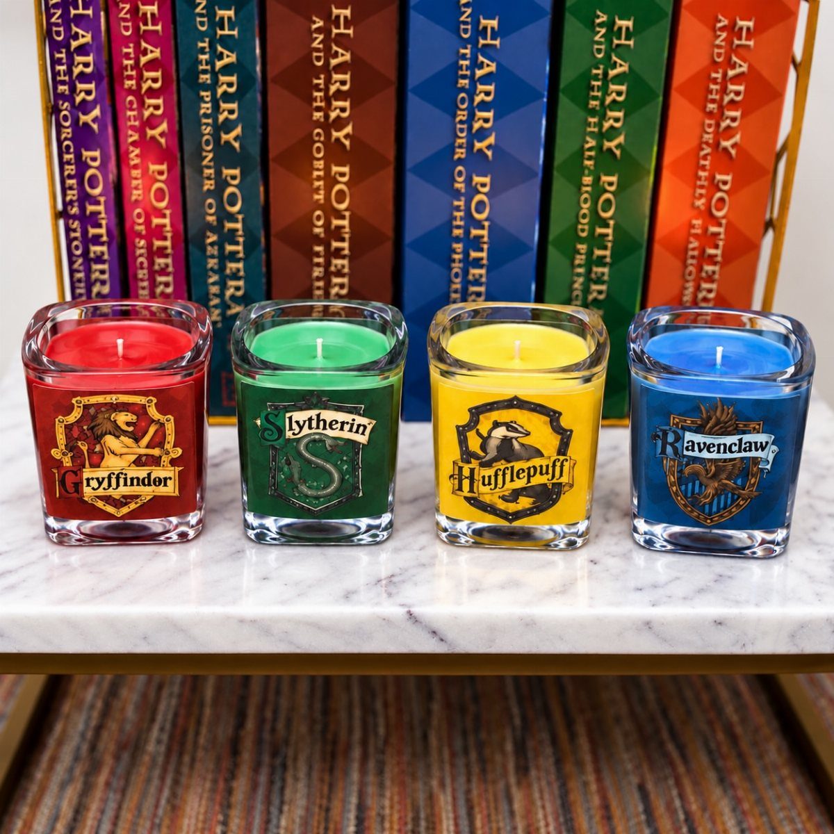 25 Best Harry Potter Gifts for Every Wizarding Fan in 2026 5 Four Hogwarts house candles in glass jars in front of Harry Potter books