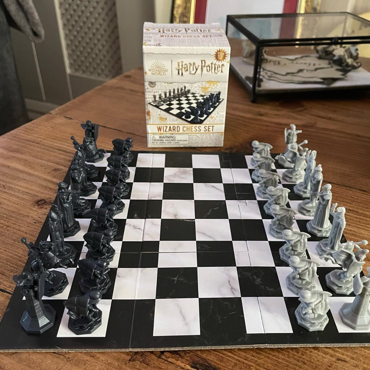 25 Best Harry Potter Gifts for Every Wizarding Fan in 2026 1 Harry Potter Wizard Chess set with black and white pieces on a marble board
