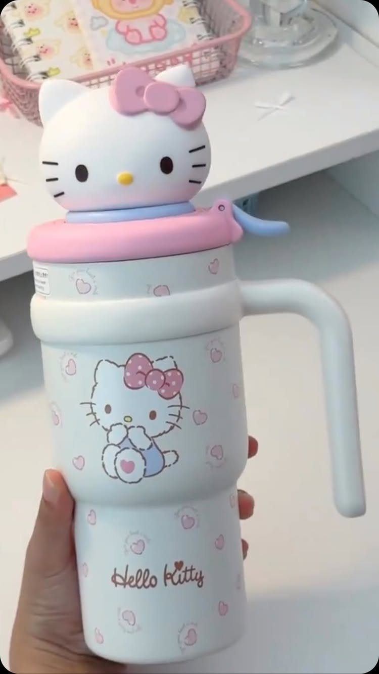 Hello Kitty themed water bottle with a 3D figure on the lid