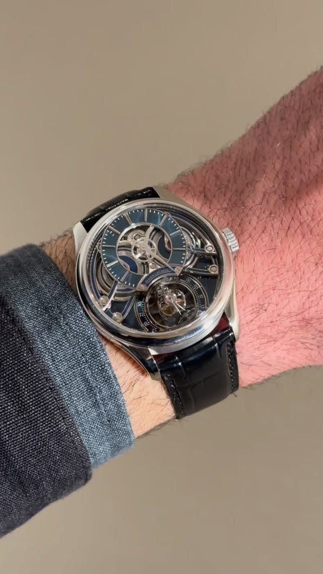 Luxury skeleton watch with black leather strap on a man's wrist