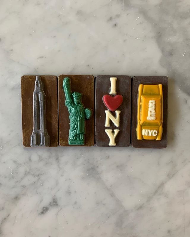 Four chocolate bars featuring New York City landmarks and the I Love NY logo.