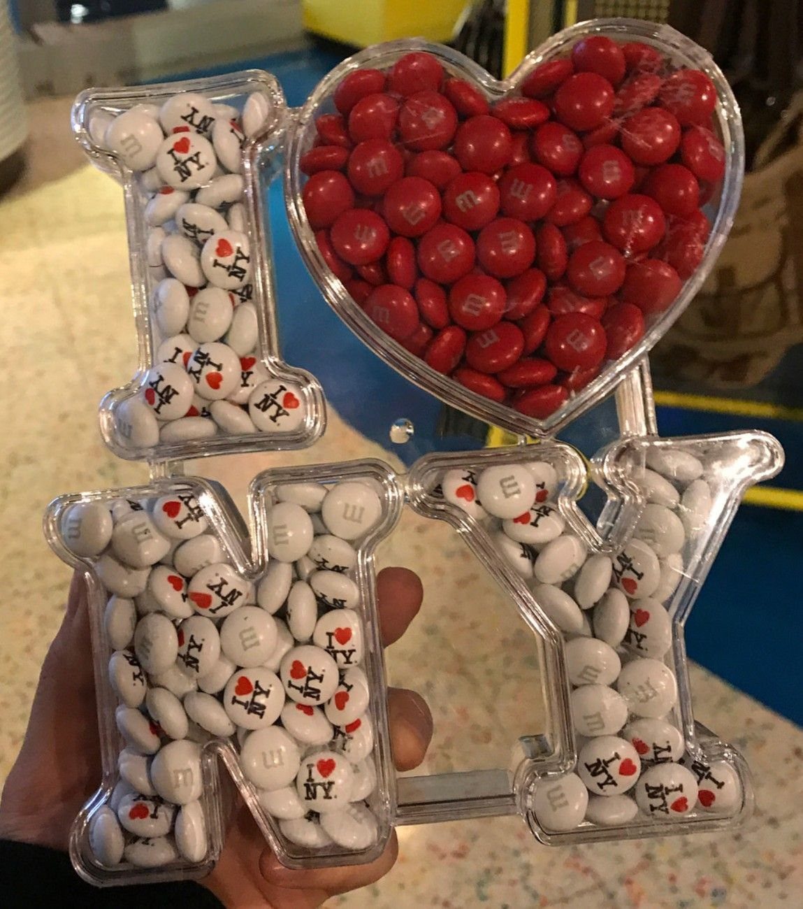I Love NY logo shaped container filled with red and white M&M candies