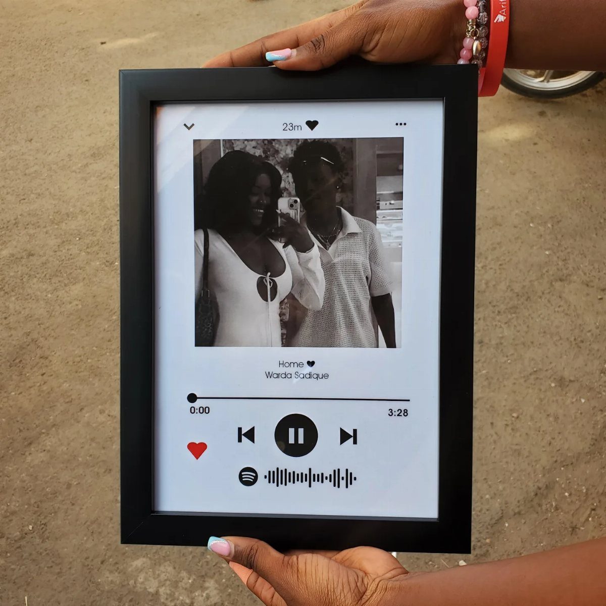 20 Ideal Boyfriend Gifts He'll Actually Use and Keep 8 Custom Spotify acrylic plaque with a couple's photo and music playback controls.
